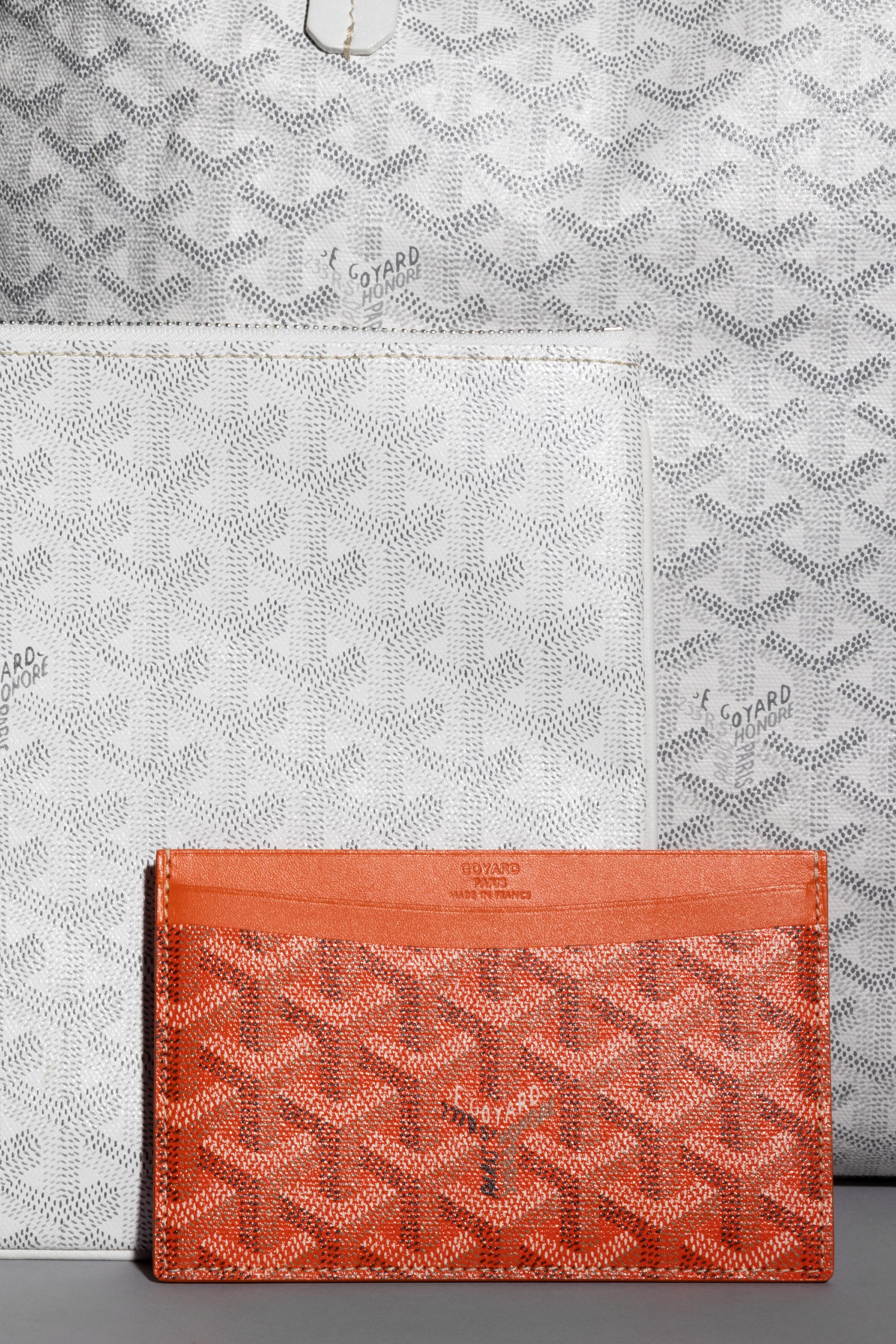 Six Goyard Items: Two Totes, Three Pouches, and One Wallet