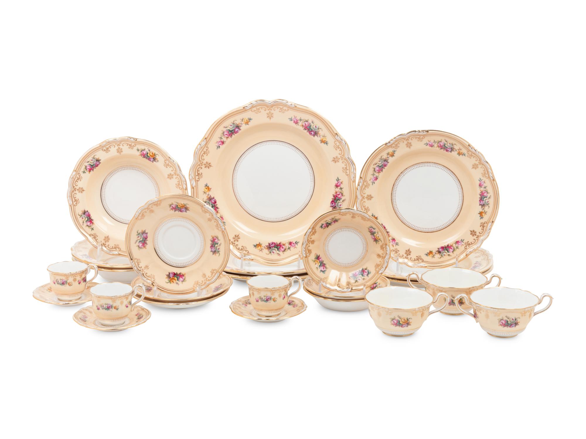 A Spode Parcel Gilt Porcelain Dinner Service