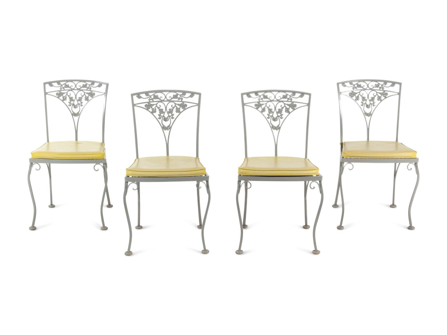 A Woodard "Orleans" Style Painted Iron Garden Table and Four Chairs