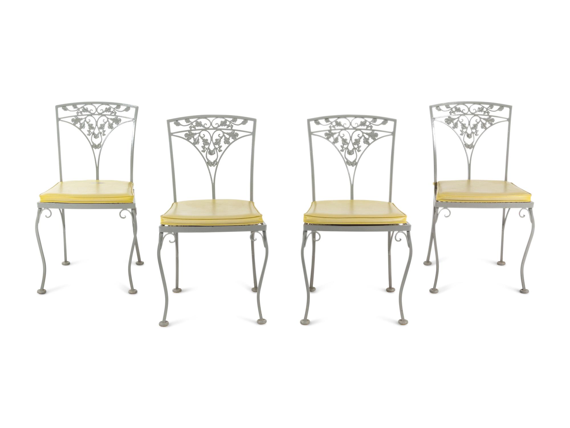 A Woodard "Orleans" Style Painted Iron Garden Table and Four Chairs