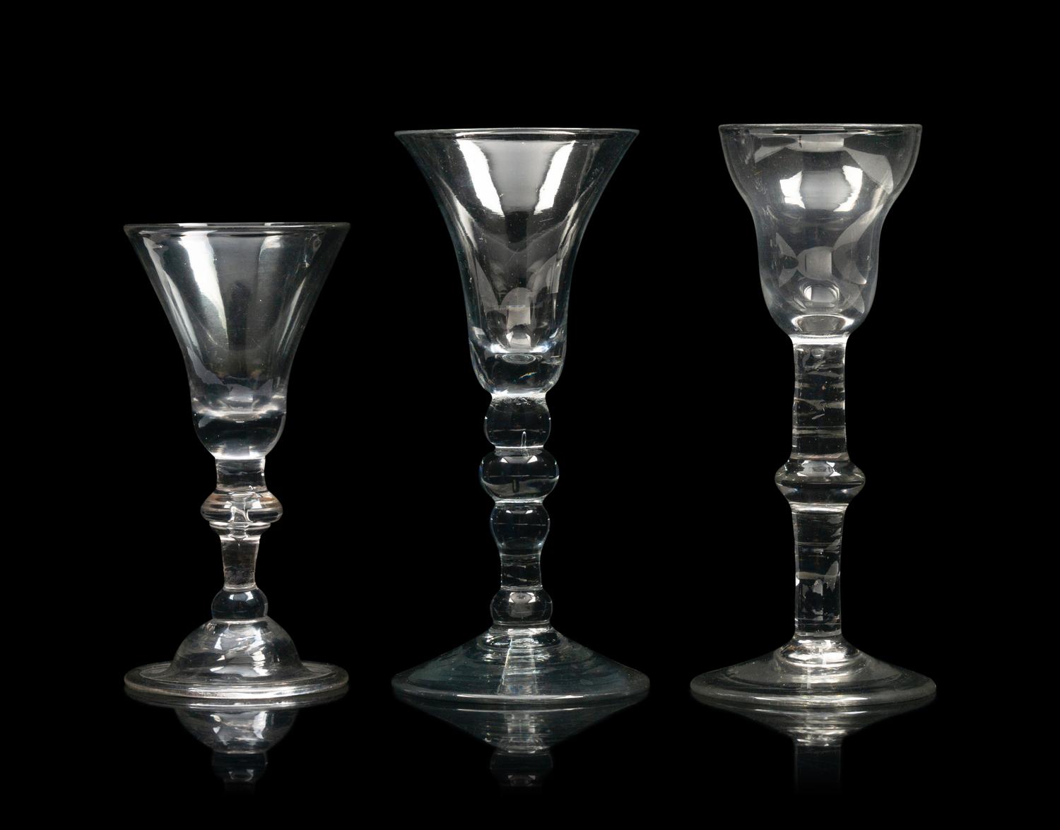 A Group of Three English Knopped Stem Wine Glasses