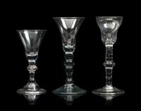 A Group of Three English Knopped Stem Wine Glasses