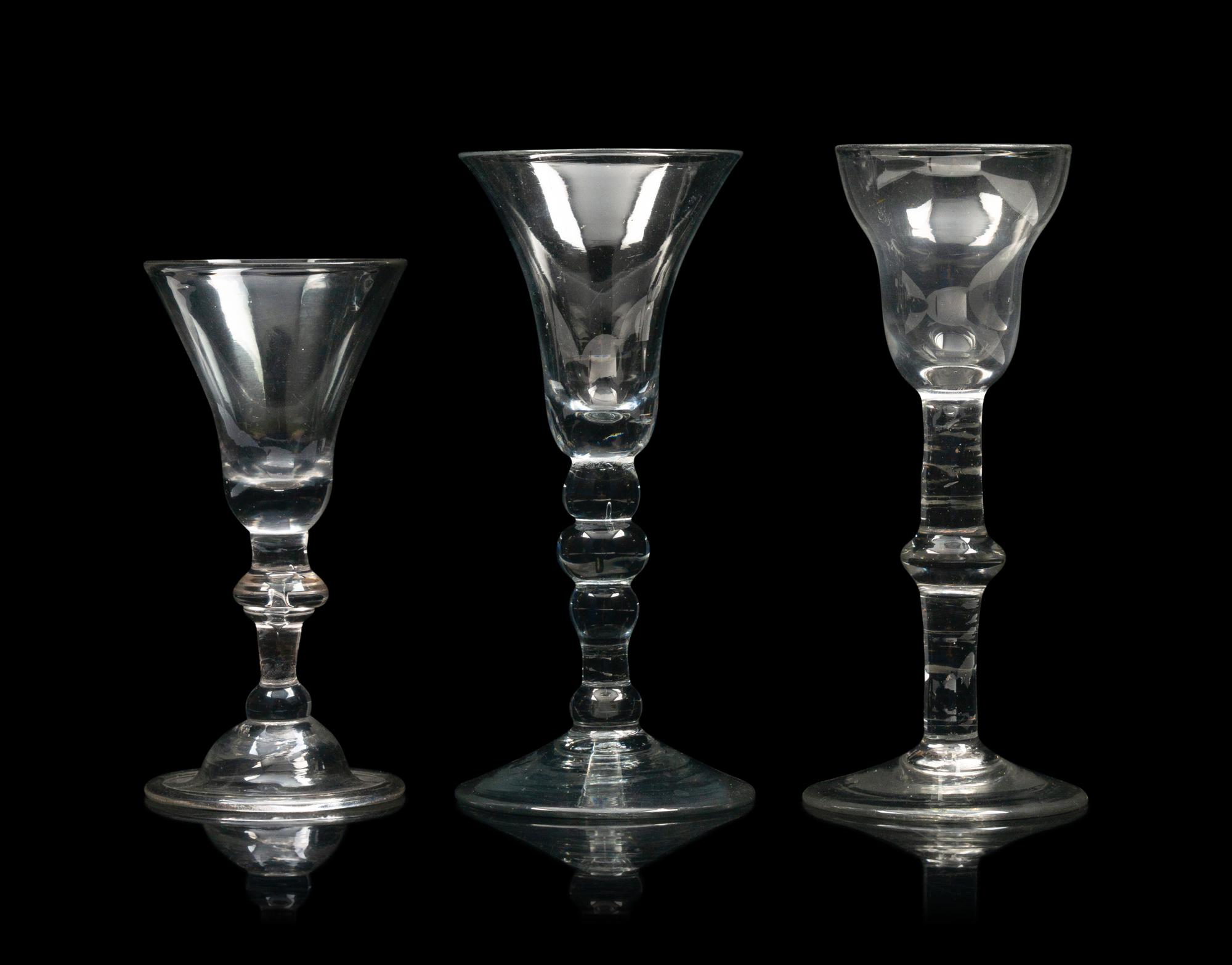 A Group of Three English Knopped Stem Wine Glasses