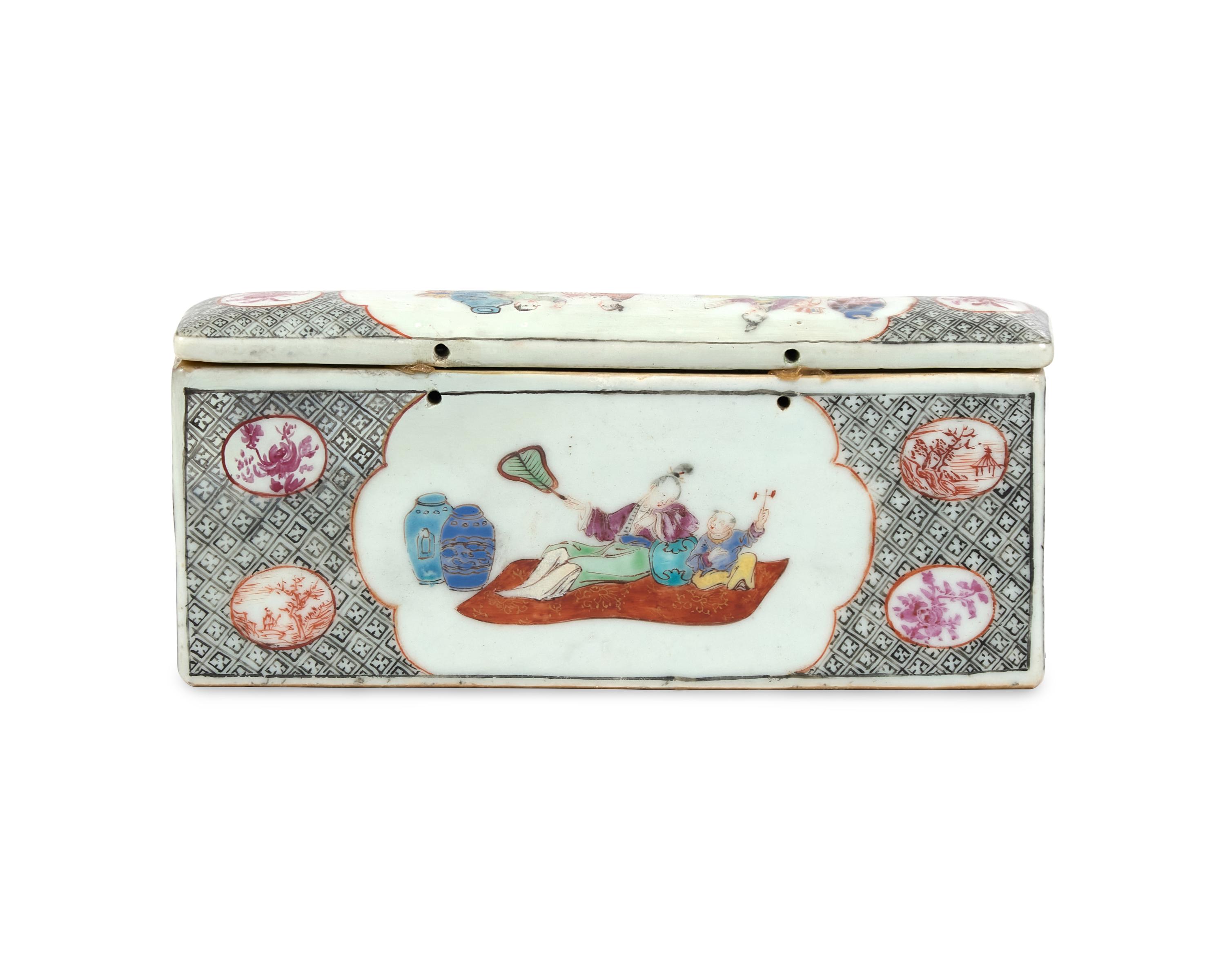 A Chinese Export Porcelain Famille Rose Inkstand And Pair Of Candlesticks