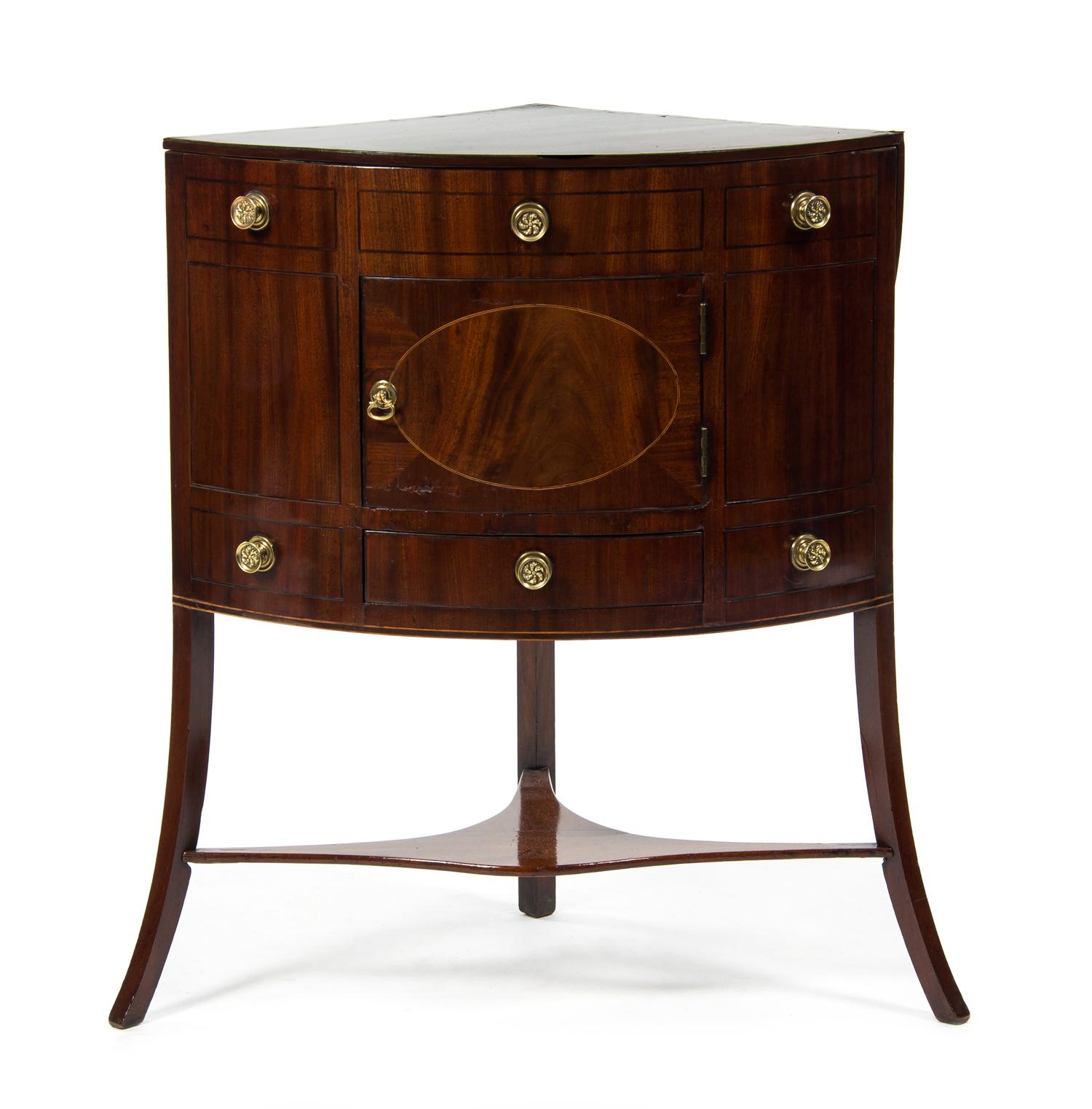 A George III Mahogany Corner Washstand, EARLY 19TH CENTURY, Height 49 x width 26 1/2 x depth 19 inches. — EARLY 19TH CENTURY,