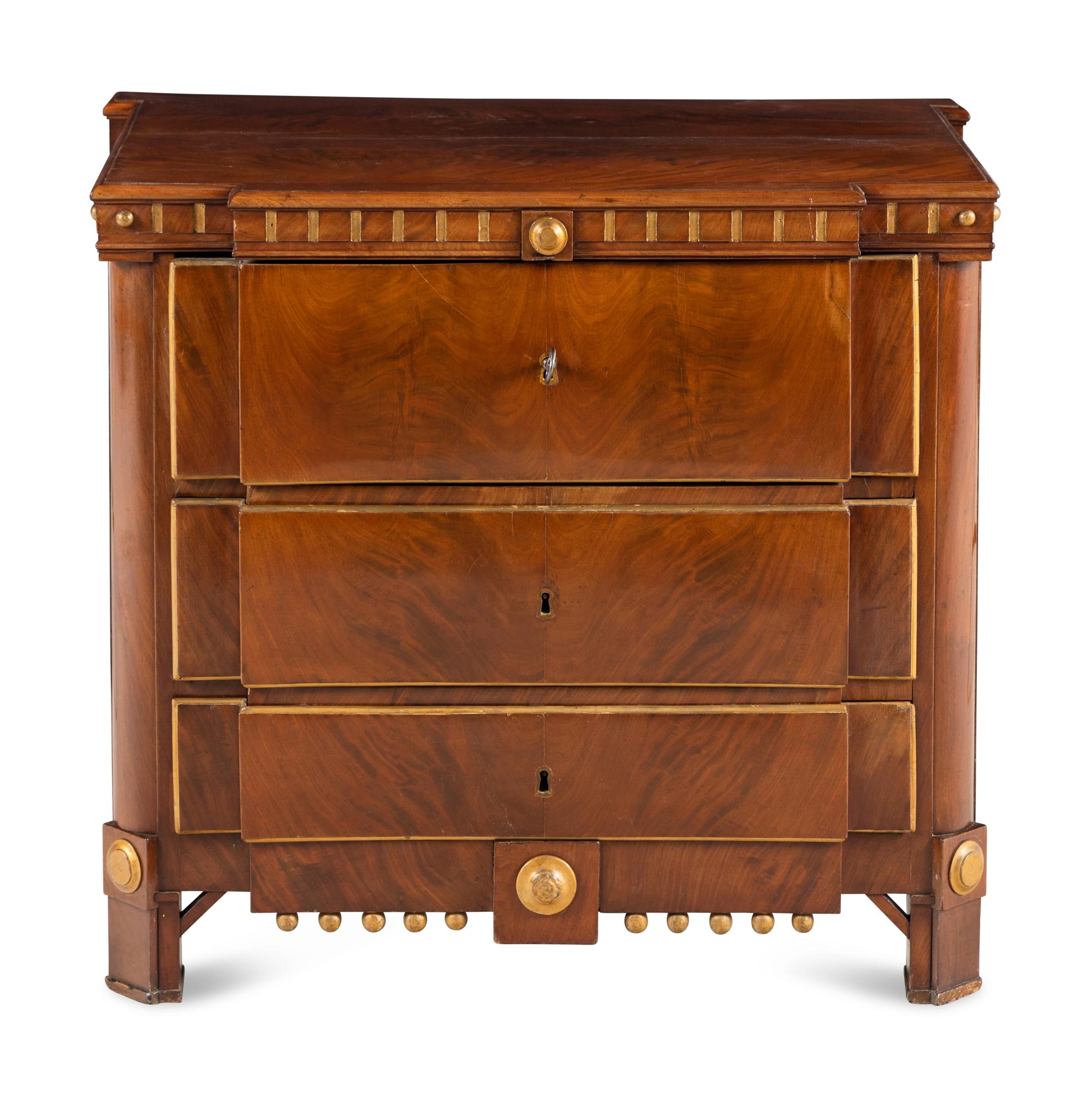 A Baltic Style Parcel Gilt Mahogany Chest of Drawers