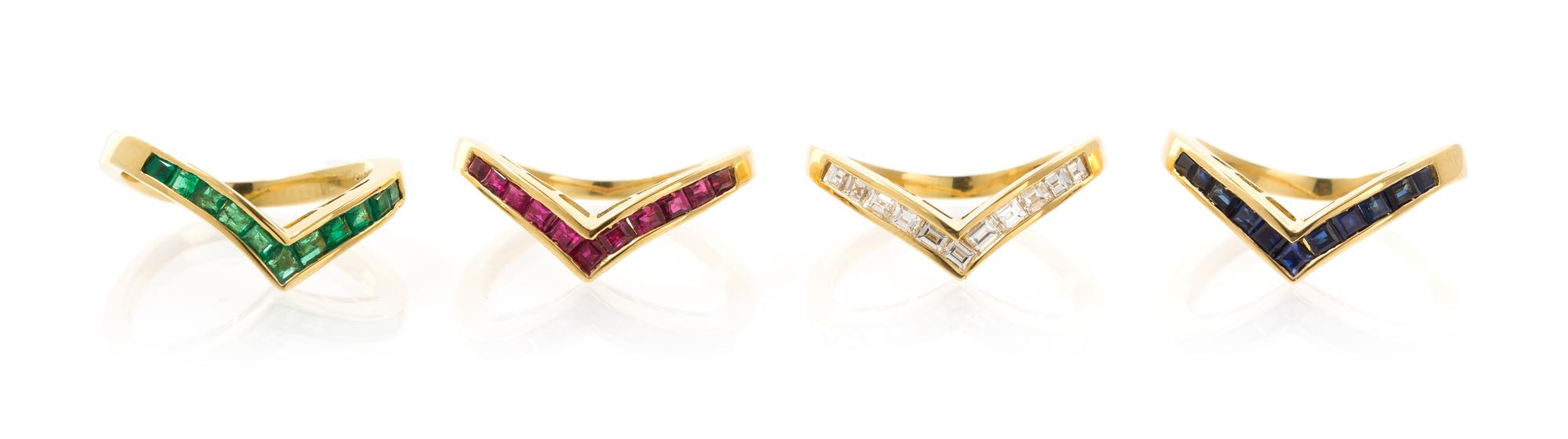 A Collection of 18 Karat Yellow Gold, Diamond, Sapphire, Ruby and Emerald Stacking Rings, 9.80 dwts.