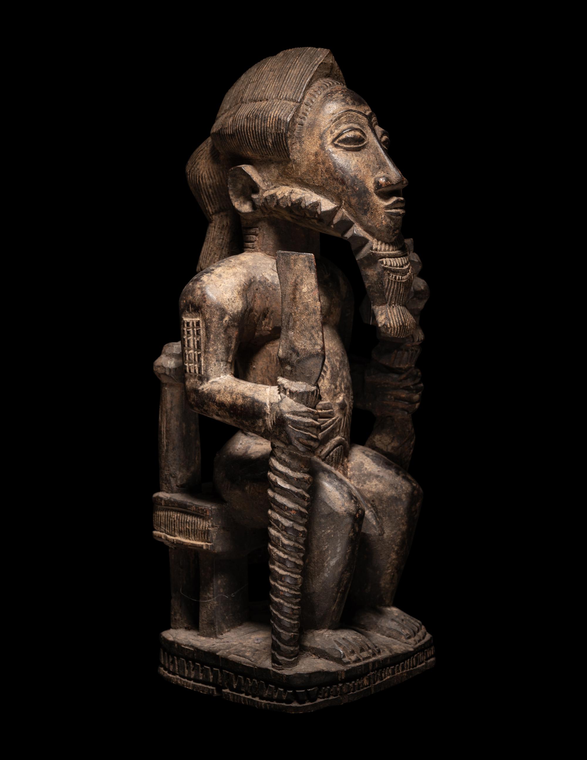 A Baule Wood Seated Male Figure
