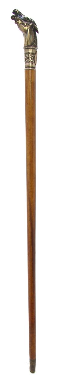An American Sterling Silver Handled Cane, Length of handle 4 x length overall 30 1/2 inches.