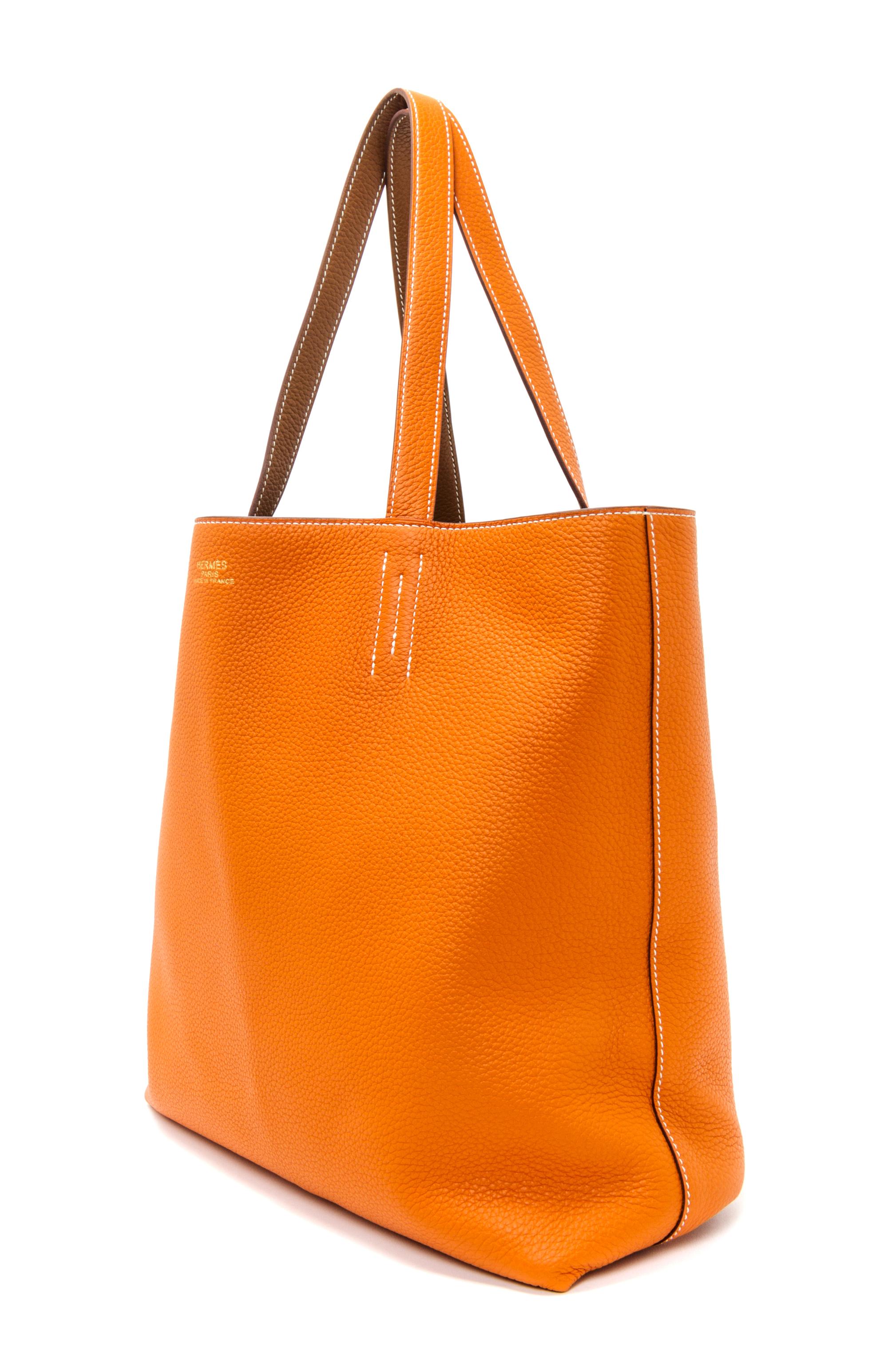 An Hermes Orange/Gold 45cm Taurillon Clemence Double Sens Tote, 17.5" x 15.5" x 5".