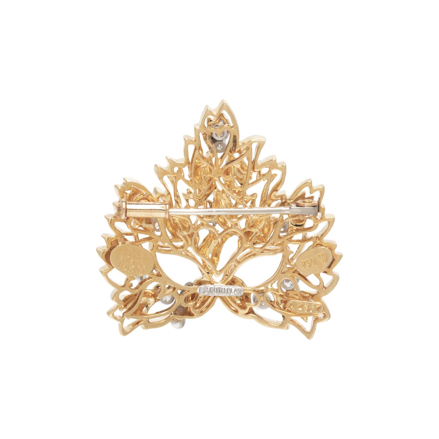 HENRY DUNAY, YELLOW GOLD AND DIAMOND MASK BROOCH