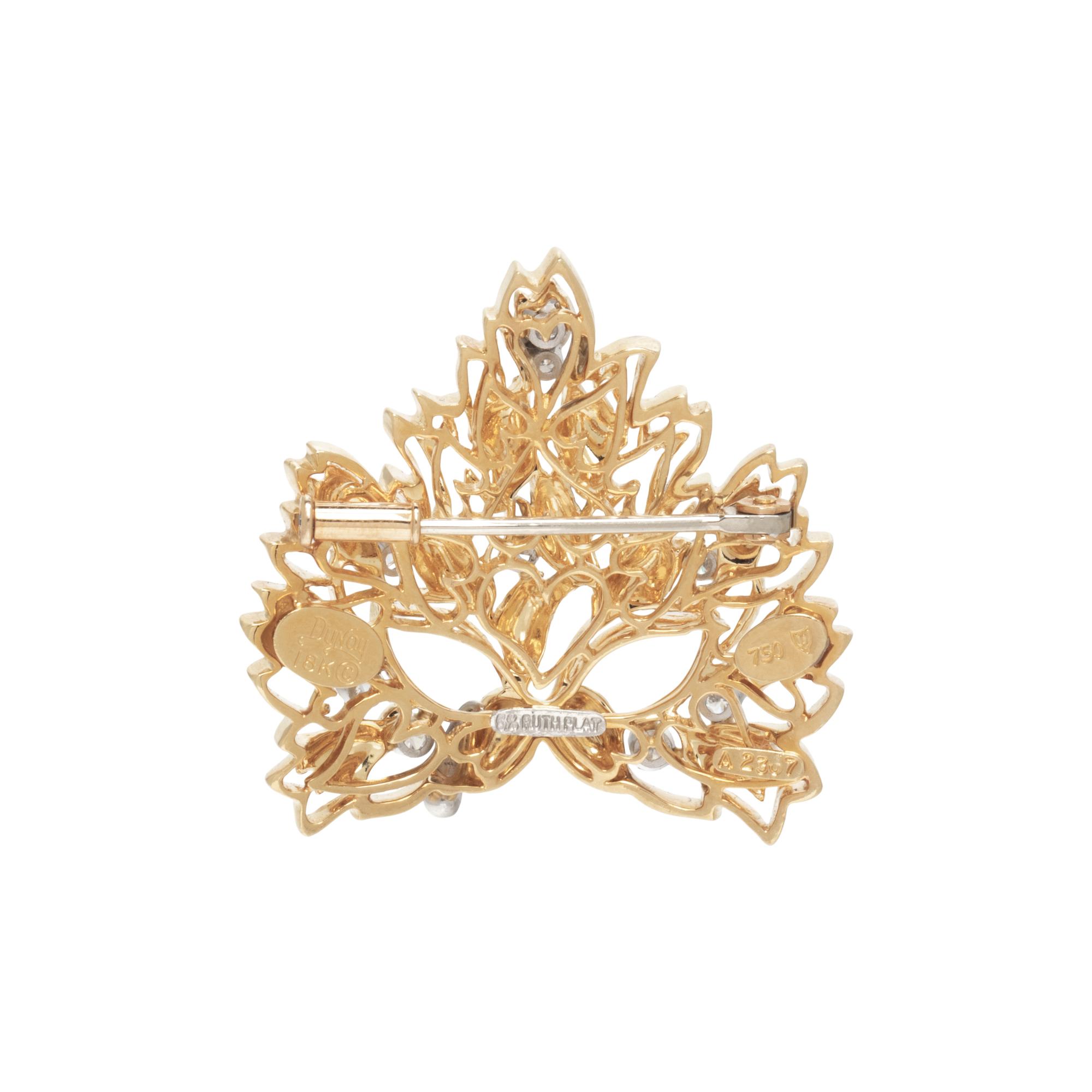 HENRY DUNAY, YELLOW GOLD AND DIAMOND MASK BROOCH