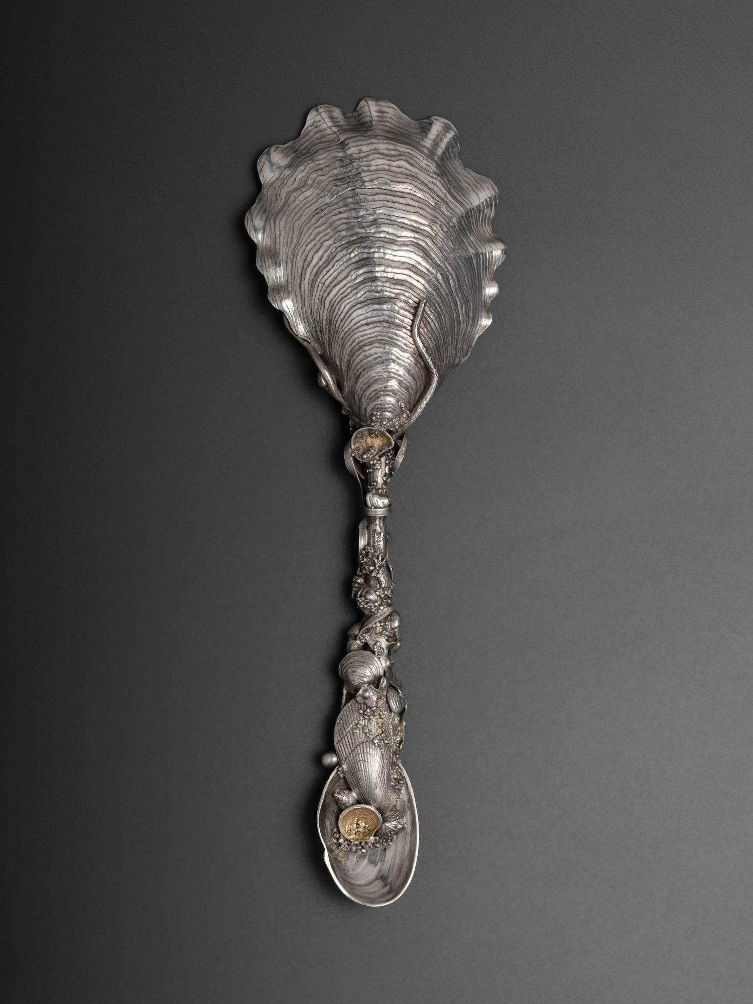 An American Parcel Gilt Silver Serving Spoon