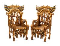 A Pair of Egyptianesque Painted and Giltwood Throne Chairs