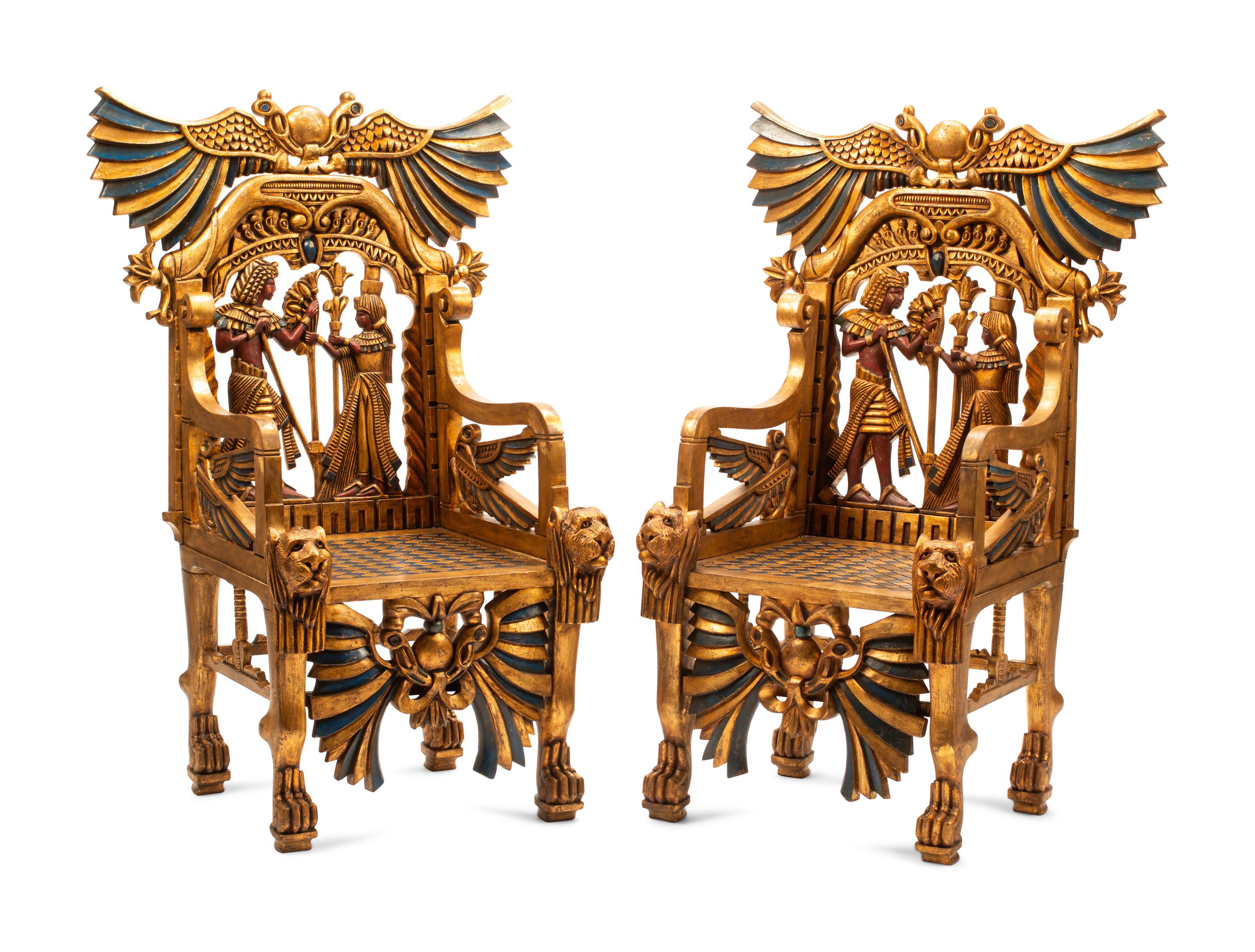A Pair of Egyptianesque Painted and Giltwood Throne Chairs