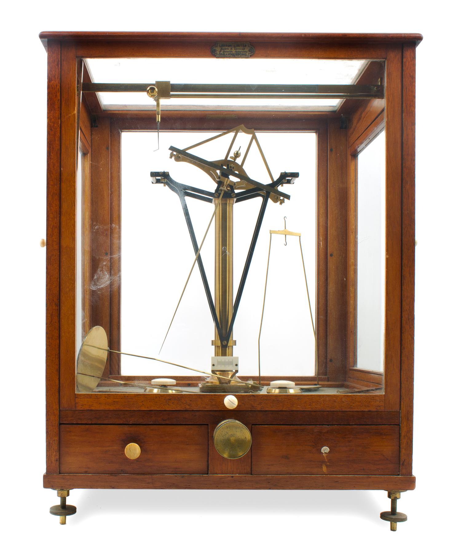 An English Brass and Wood-Cased Assayer's Balance Height of case 23 1/2 x width 17 x depth 12 1/2 inches. — L. OERTLING, LONDON, LATE 19TH/EARLY 20TH CENTURY