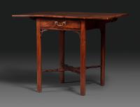 A Late Chippendale Carved and Figured Mahogany Stretcher-Base Pembroke Table
