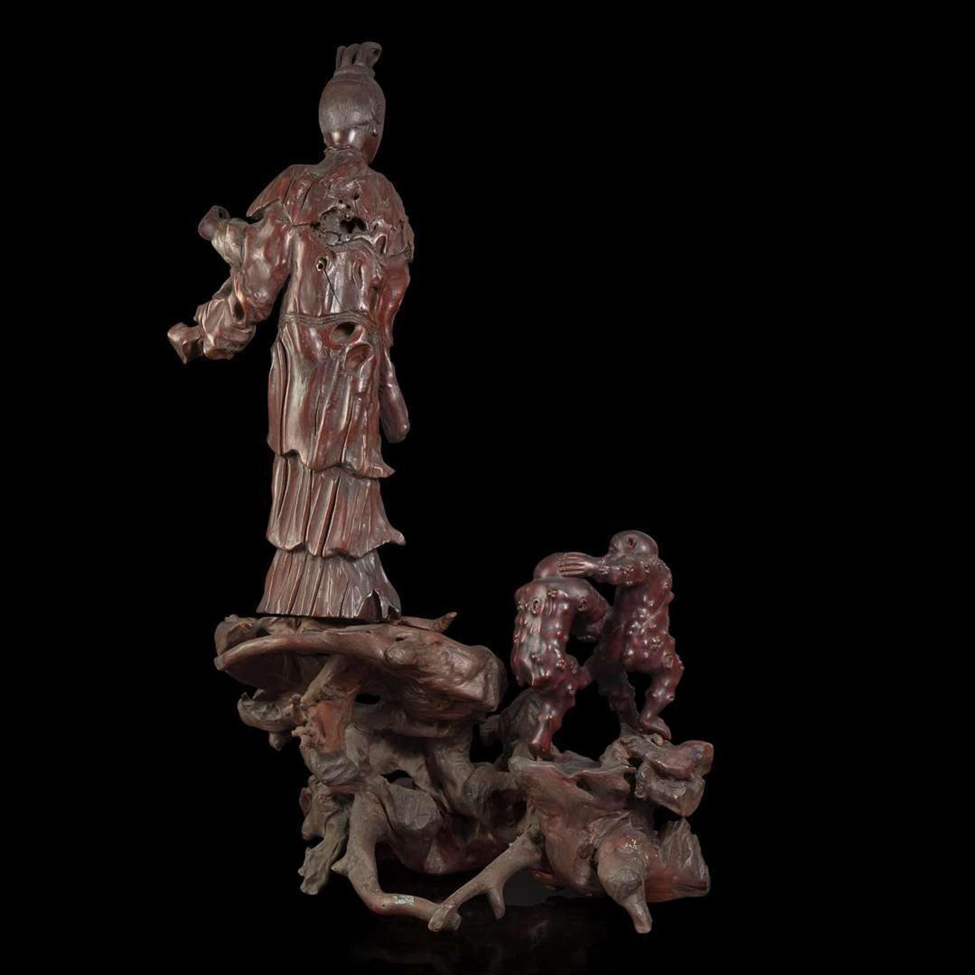 A large Chinese carved rootwood figural group depicting a meiren and monkeys 根雕美人与顽猴 Qing Dynasty ?