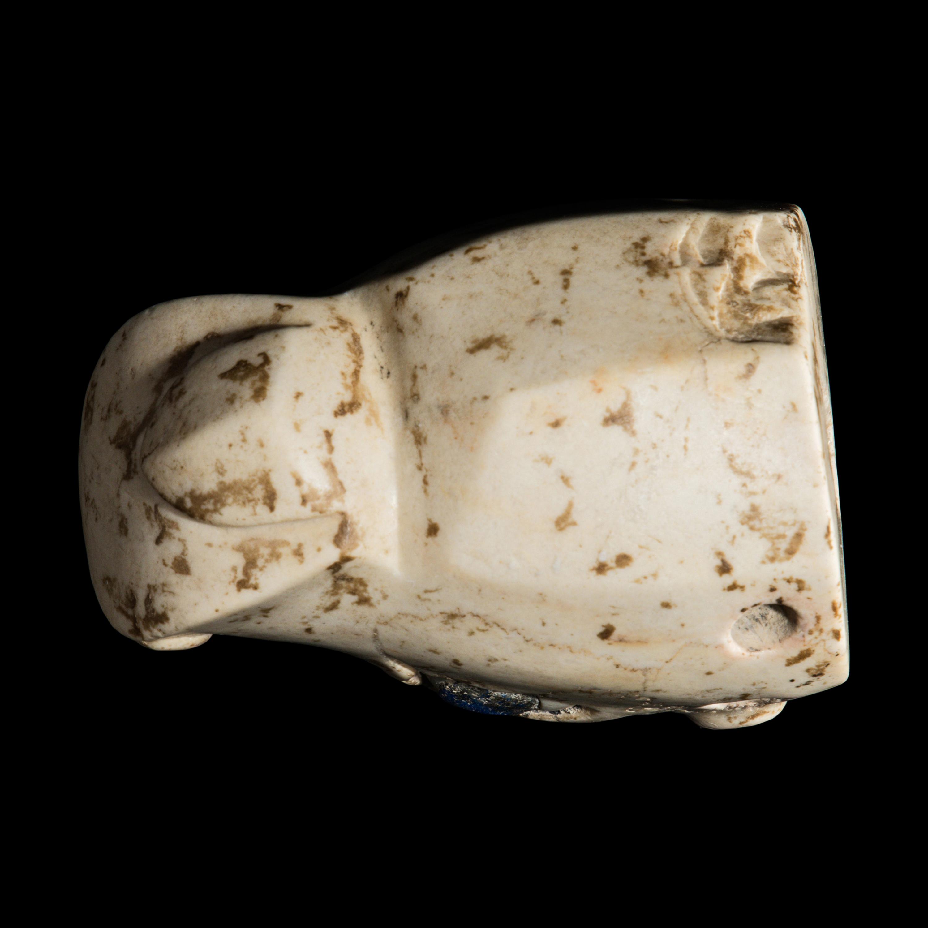 A Mesopotamian Marble and Lapis Lazuli Inlay Bull Head