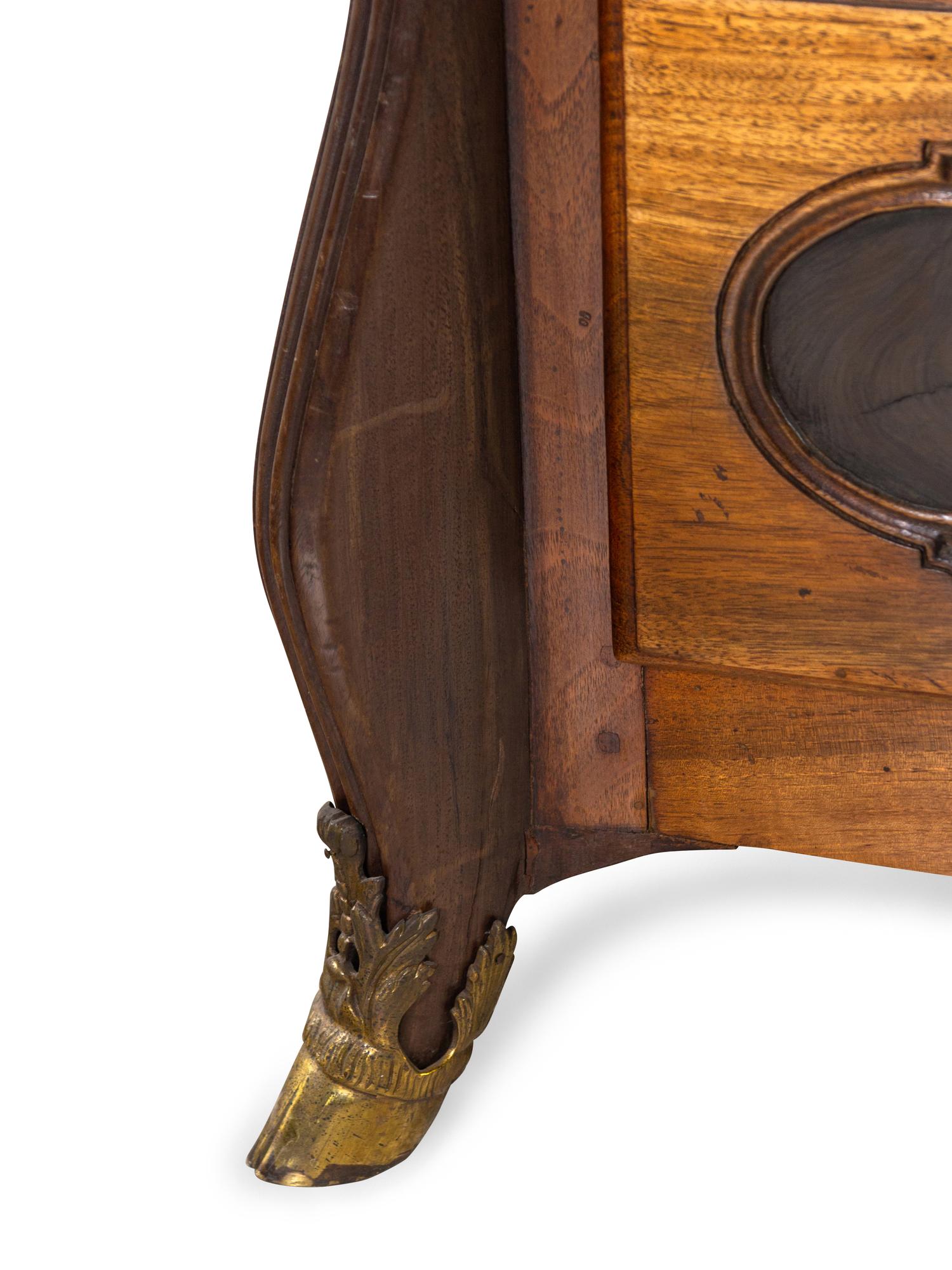 A Louis XIV Gilt Bronze Mounted Walnut and Oysterwood Commode