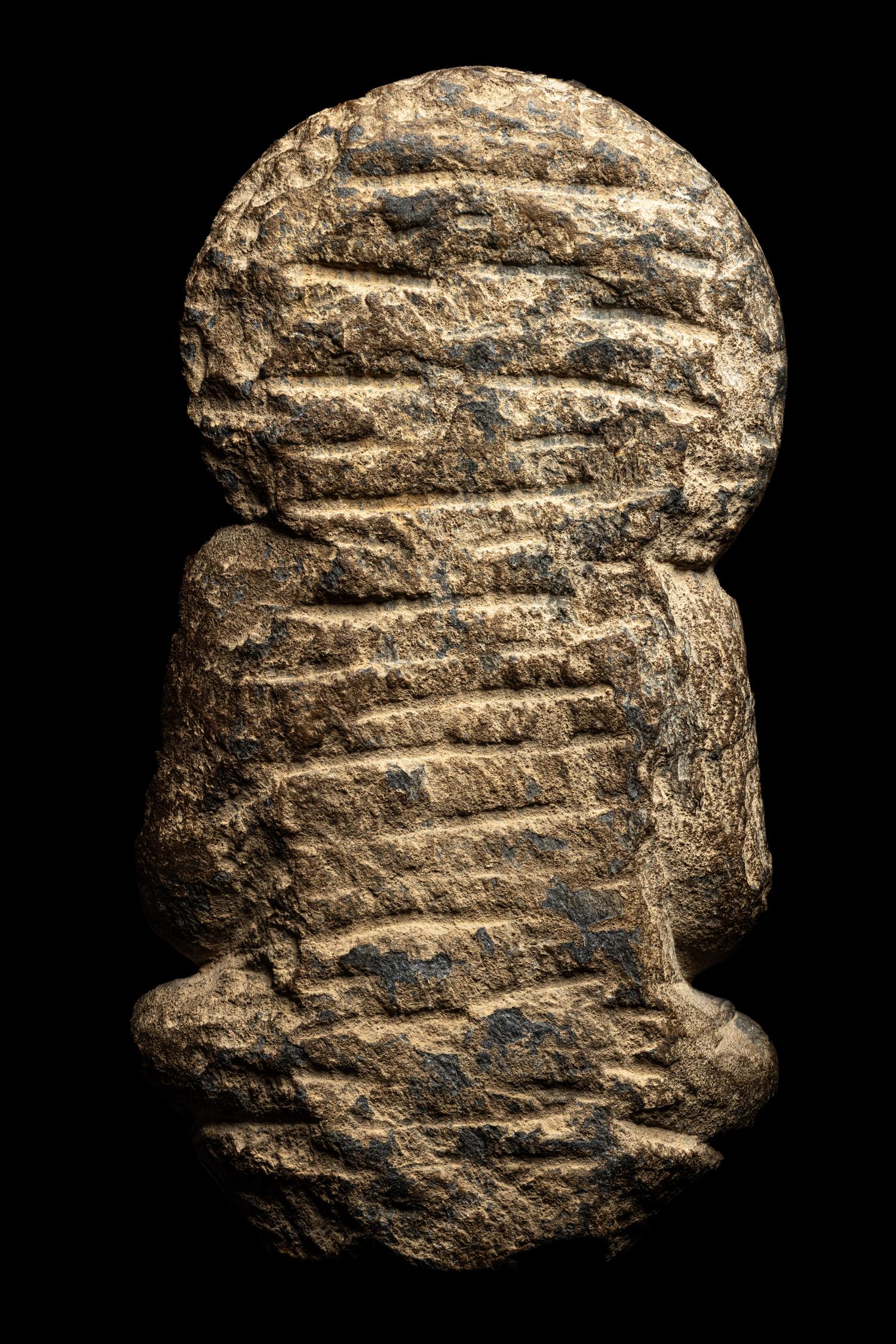 A Gandharan Grey Schist Figure of Seated Buddha