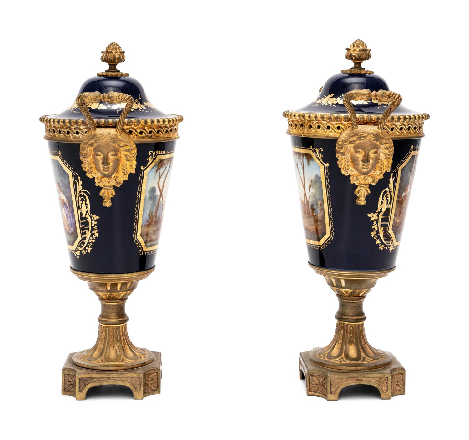A Pair of Sèvres Style Gilt Bronze-Mounted Porcelain Urns