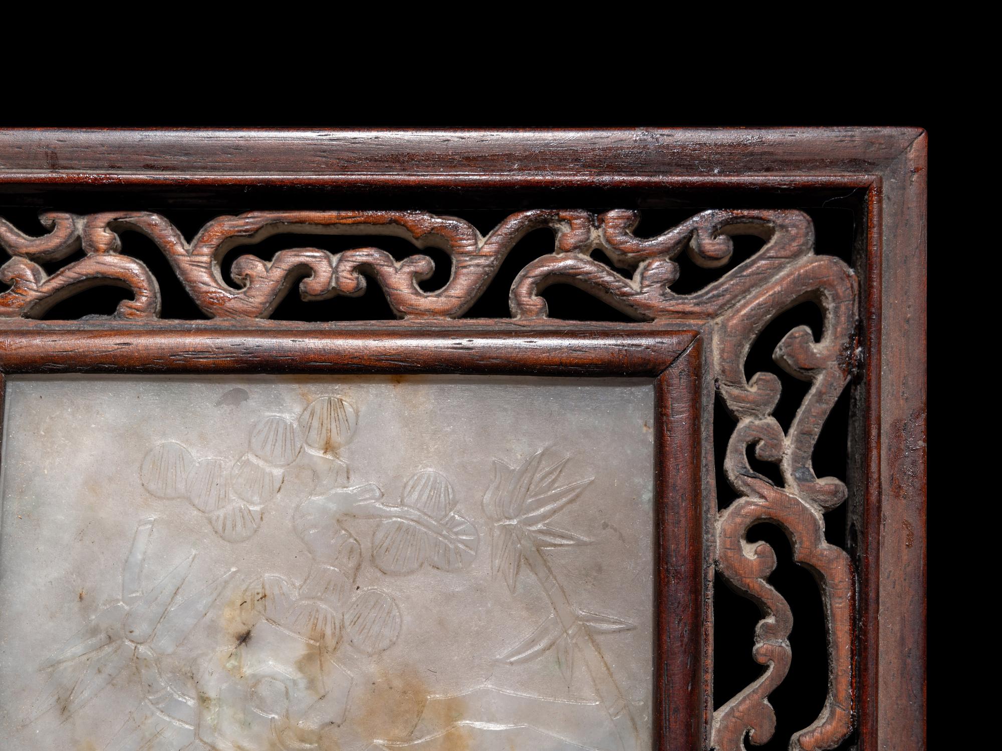 A Chinese Greyish White Jade Inset Hardwood Mounted Panel