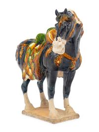 A Chinese Sancai Glazed Terracotta Model of a Horse