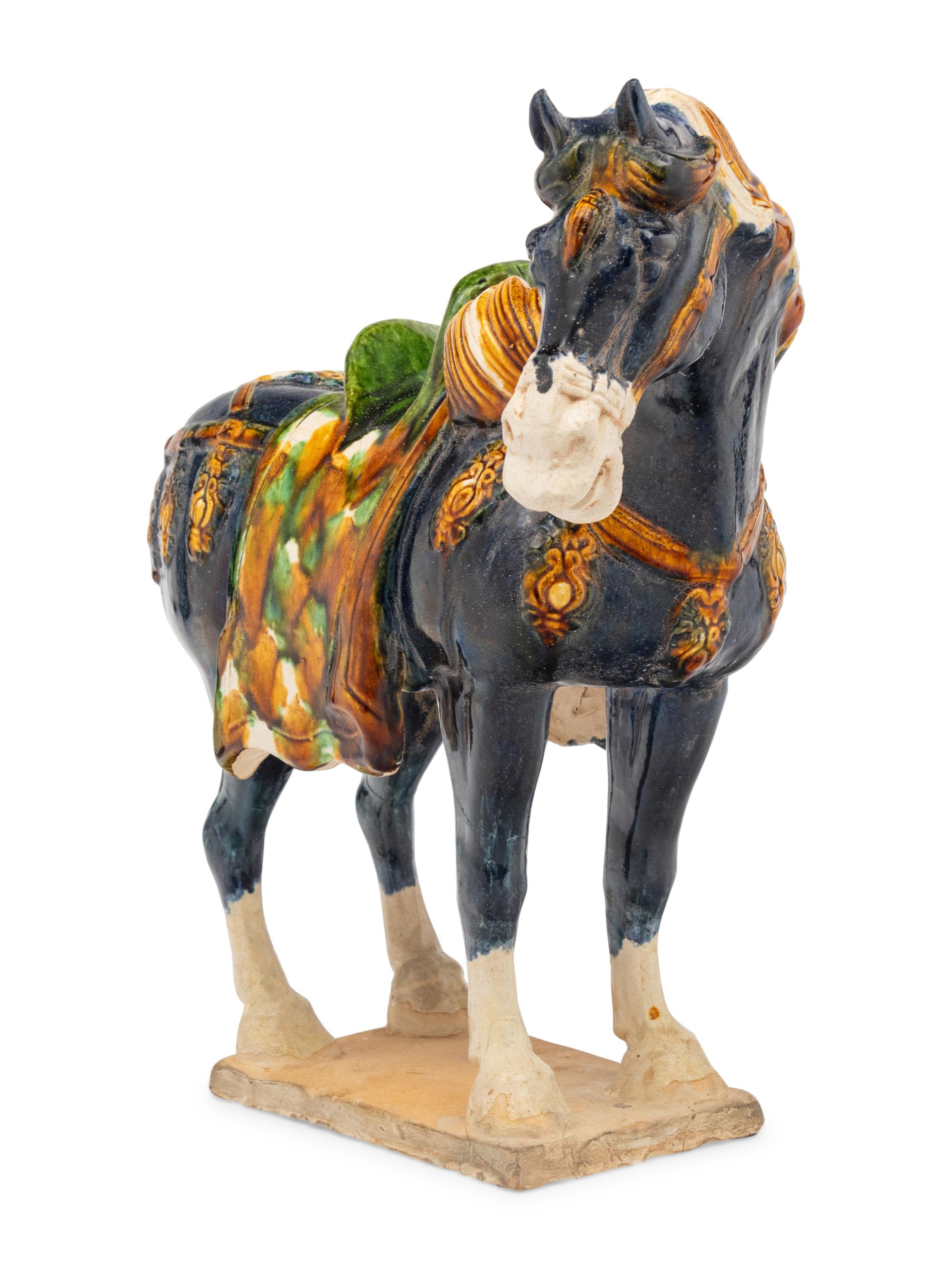 A Chinese Sancai Glazed Terracotta Model of a Horse
