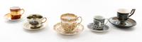 A Group of Continental Porcelain Teacups and Saucers Height of tallest teacup 2 3/4 inches.