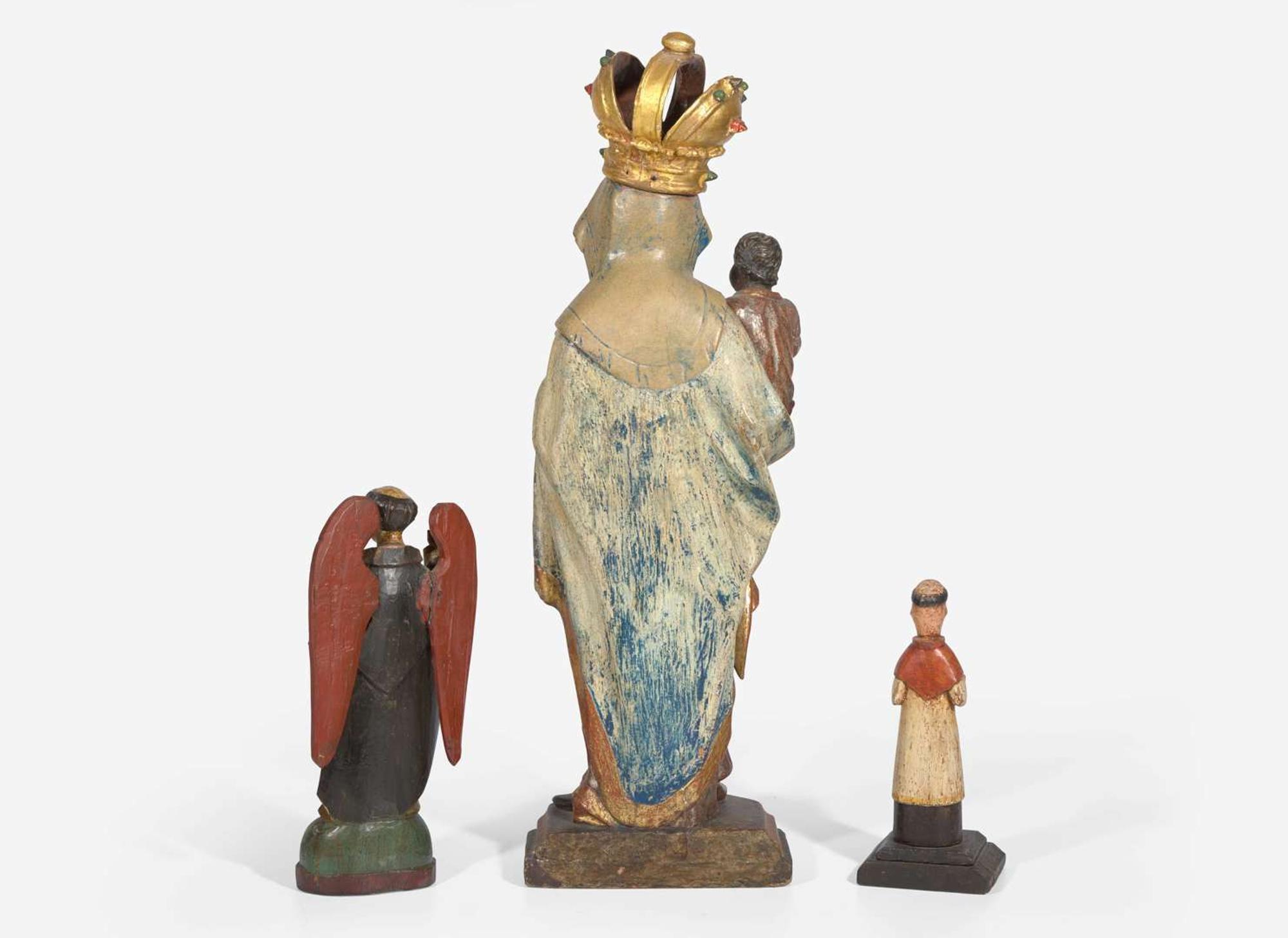 A group of three carved and painted Santos figures, 19th / 20th century