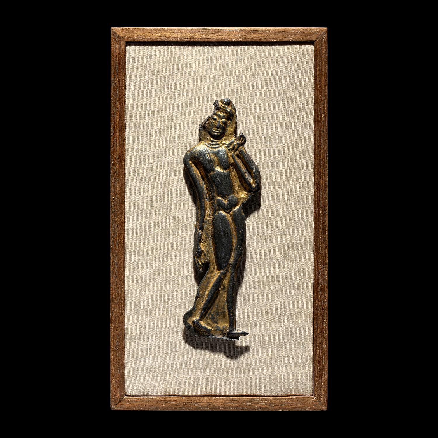 A Thai Parcel Gilt Bronze Relief of a Walking Buddha, 16th-17th Century