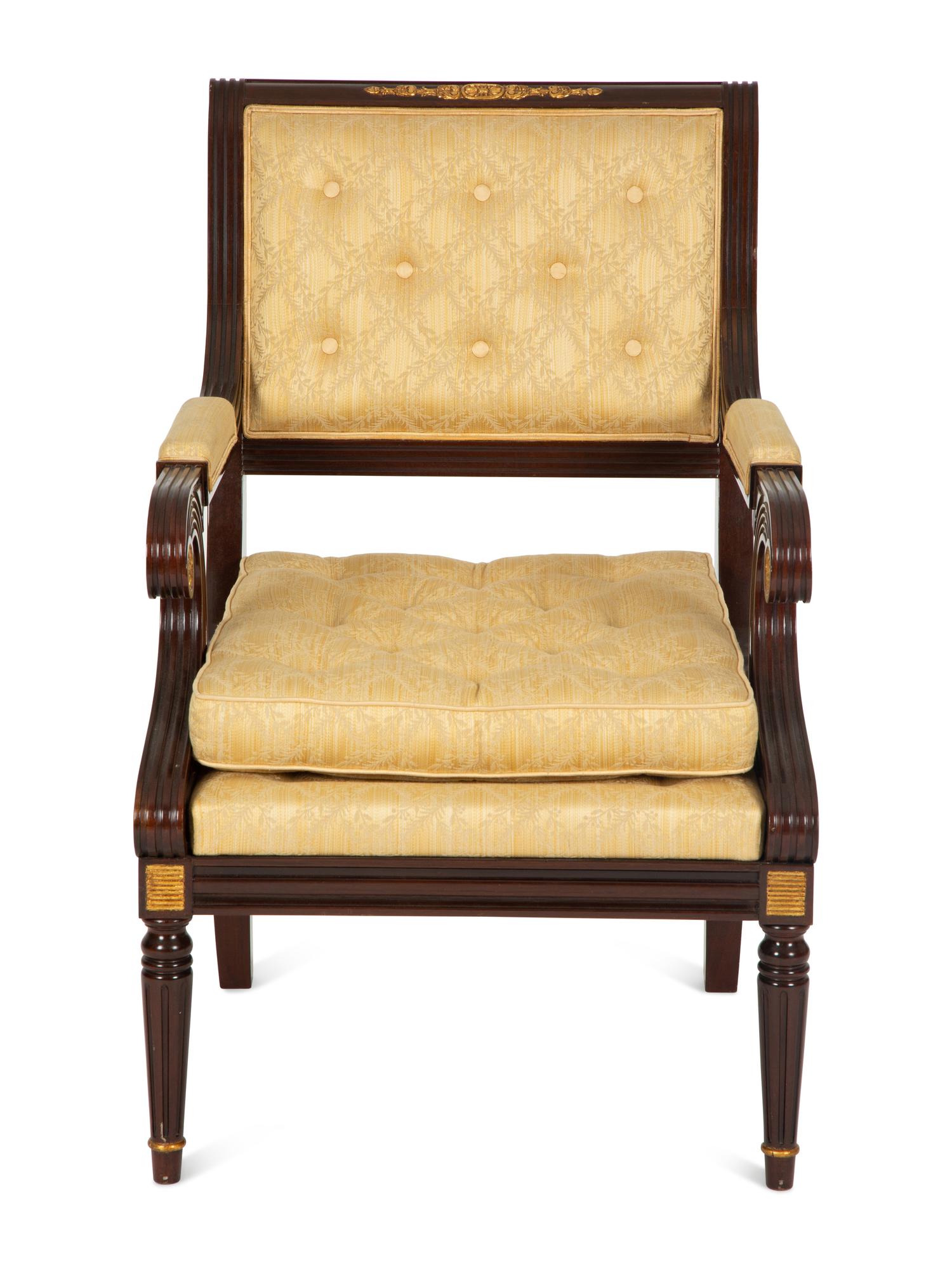 A French Empire Style Mahogany and Parcel Gilt Fauteuil