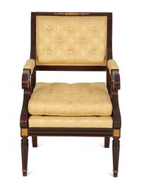 A French Empire Style Mahogany and Parcel Gilt Fauteuil