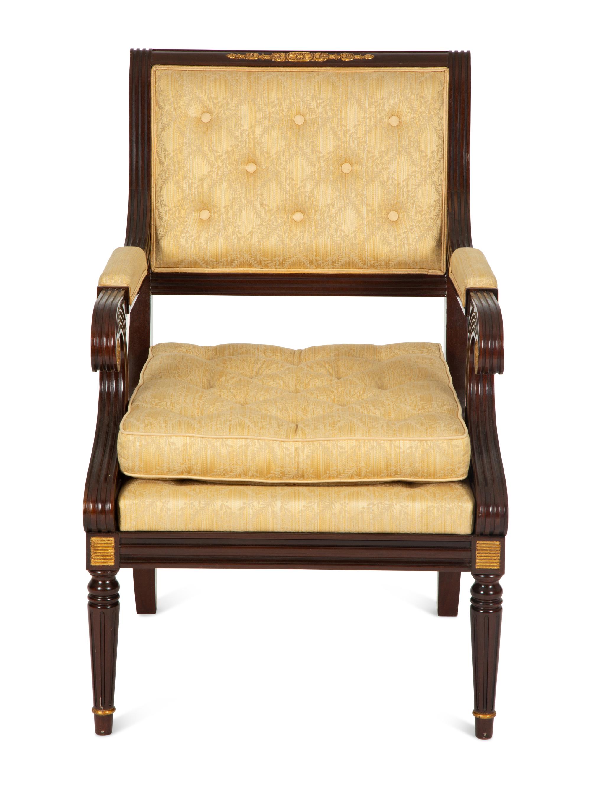 A French Empire Style Mahogany and Parcel Gilt Fauteuil