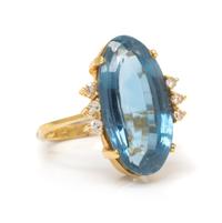 A Yellow Gold, Blue Topaz and Diamond Ring, 5.80 dwts.