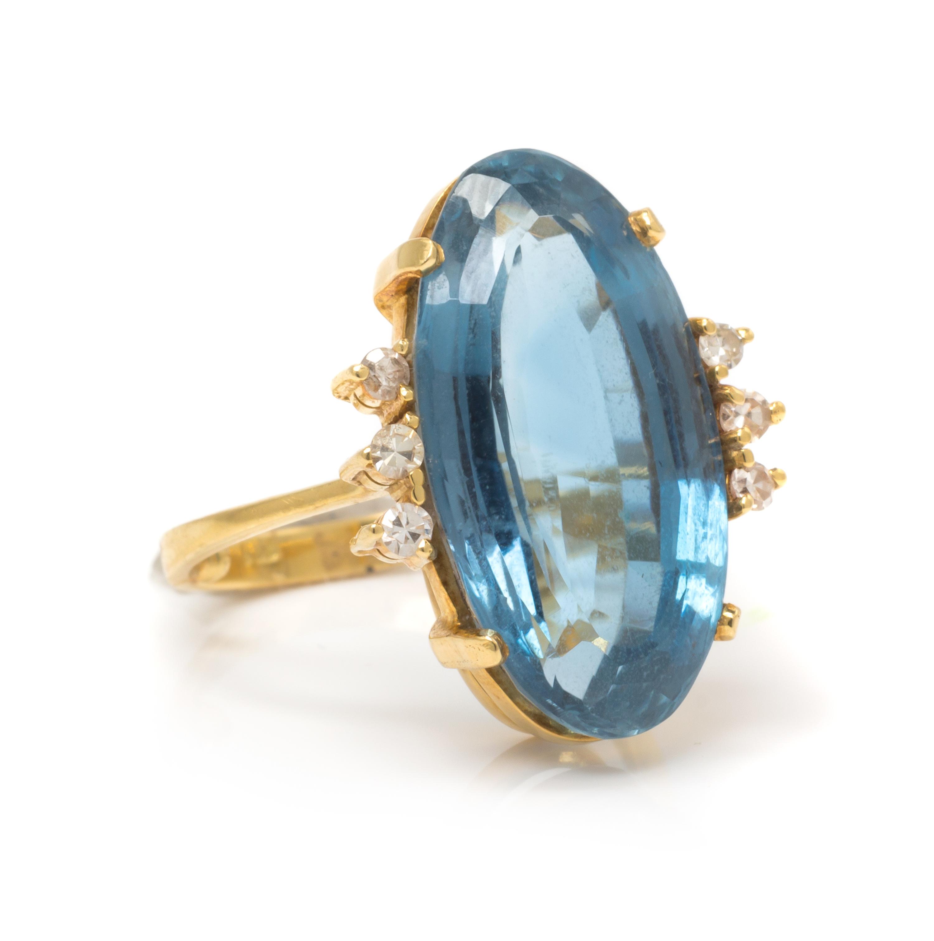 A Yellow Gold, Blue Topaz and Diamond Ring, 5.80 dwts.