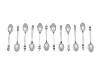 A Set of Twelve Georg Jensen Silver Coffee Spoons