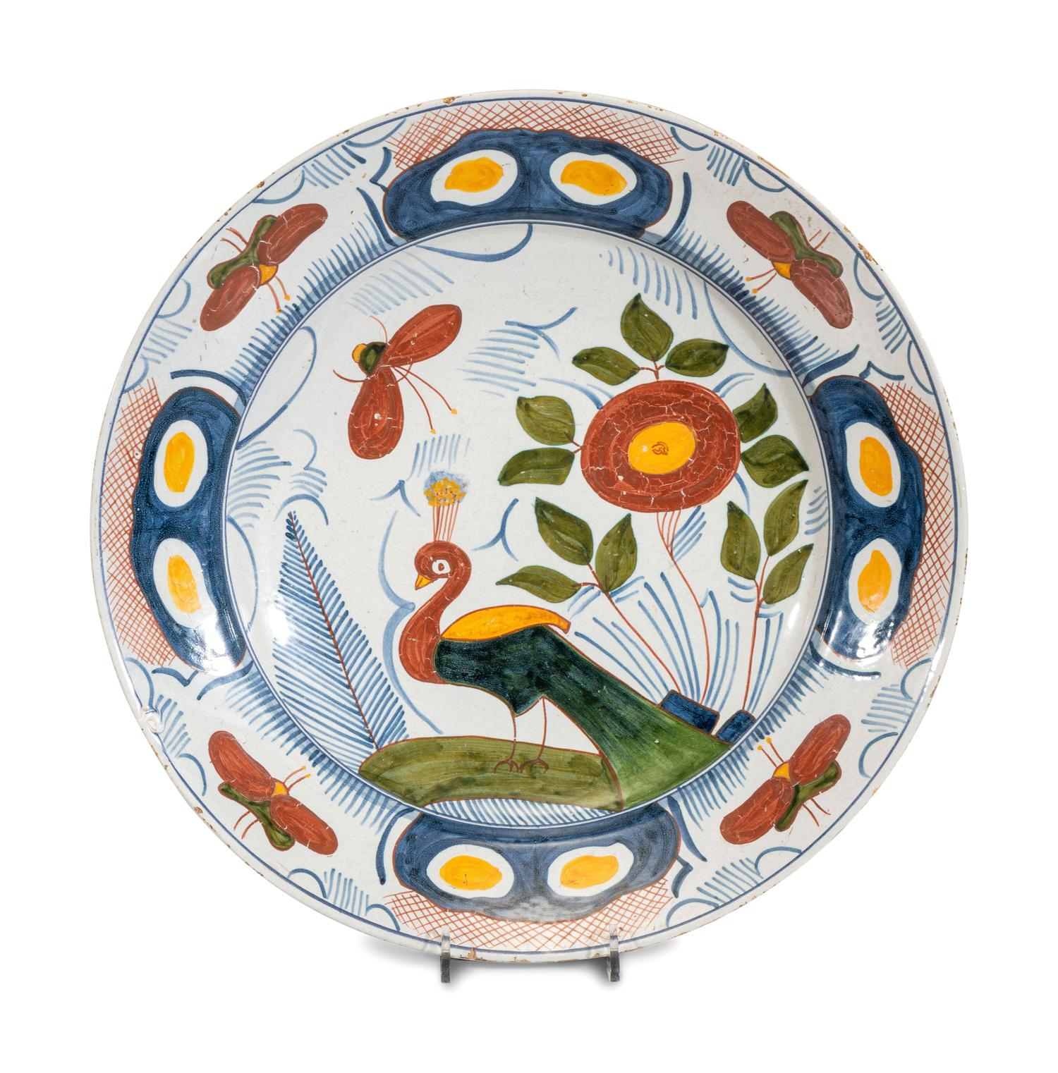 A Delftware Polychrome Peacock Charger
