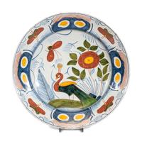 A Delftware Polychrome Peacock Charger