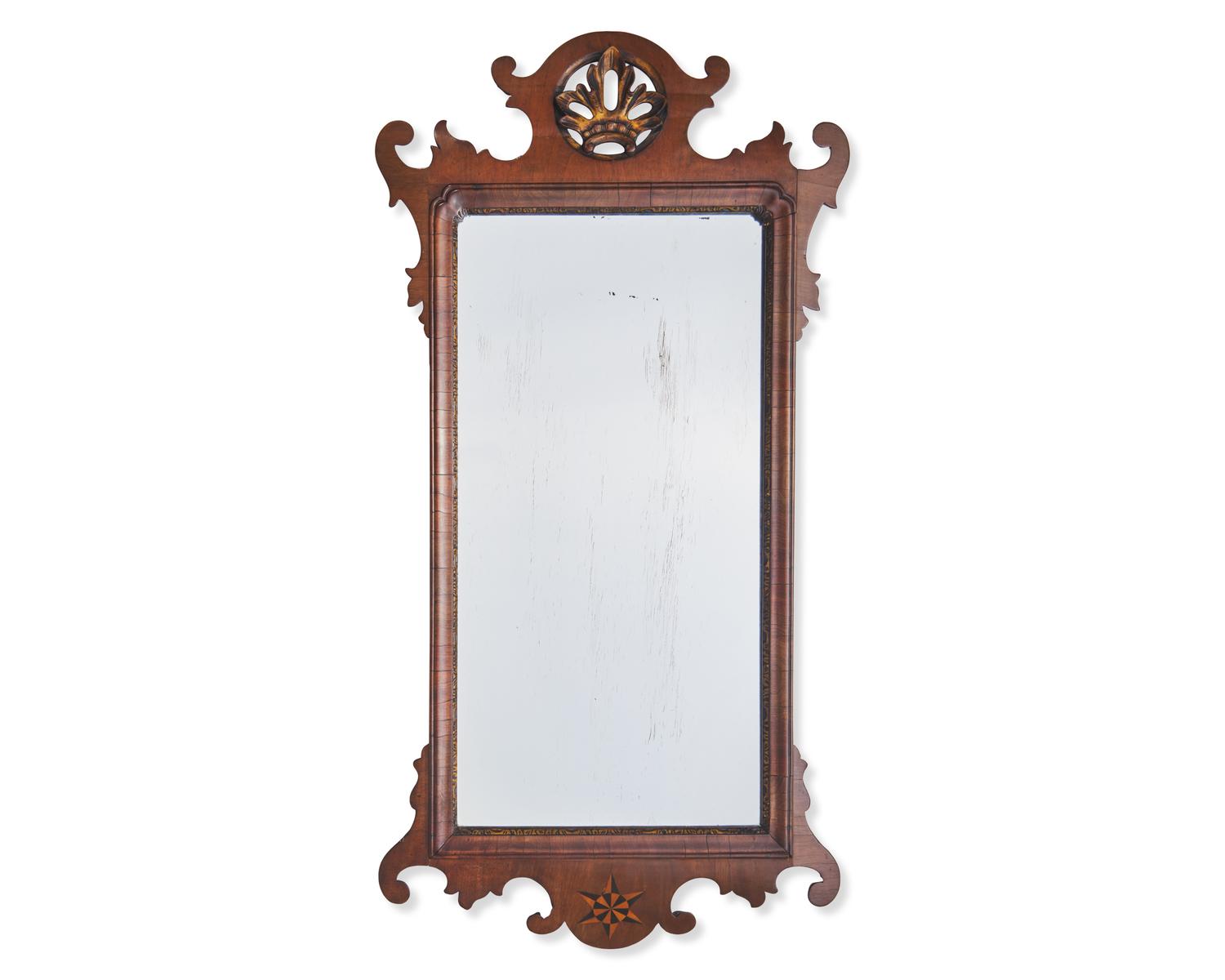 A Chippendale Fret-Carved and Parcel-Gilt and Inlaid Mahogany Mirror