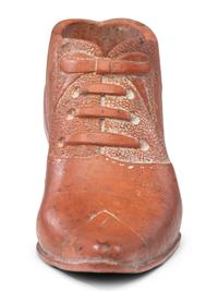 A Glazed Pottery Woman's High-Heeled Shoe