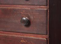 A red-painted pine tall chest, New England, circa 1800