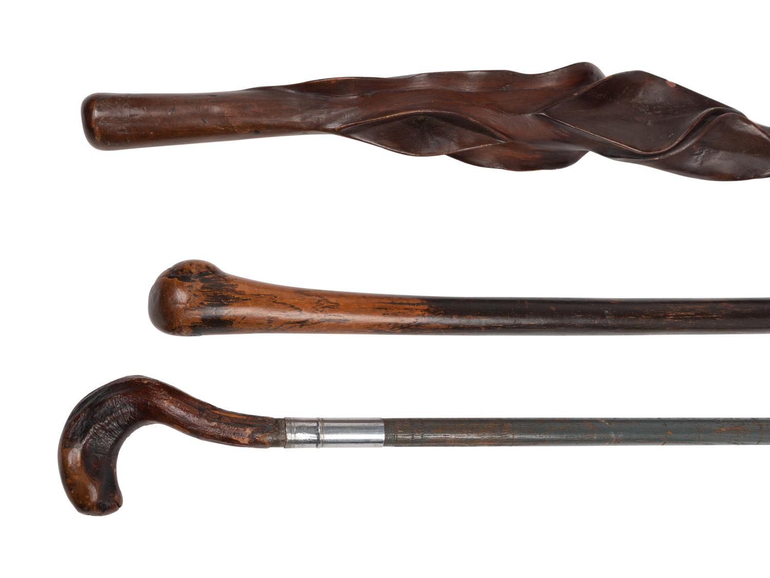 Three Carved Walnut Walking Sticks