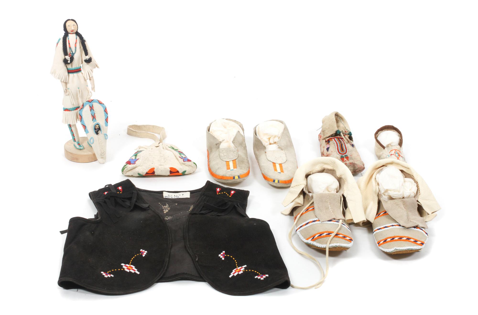 A Group of Northern Plains and Plateau Beadwork Height of doll 13 1/2 inches.
