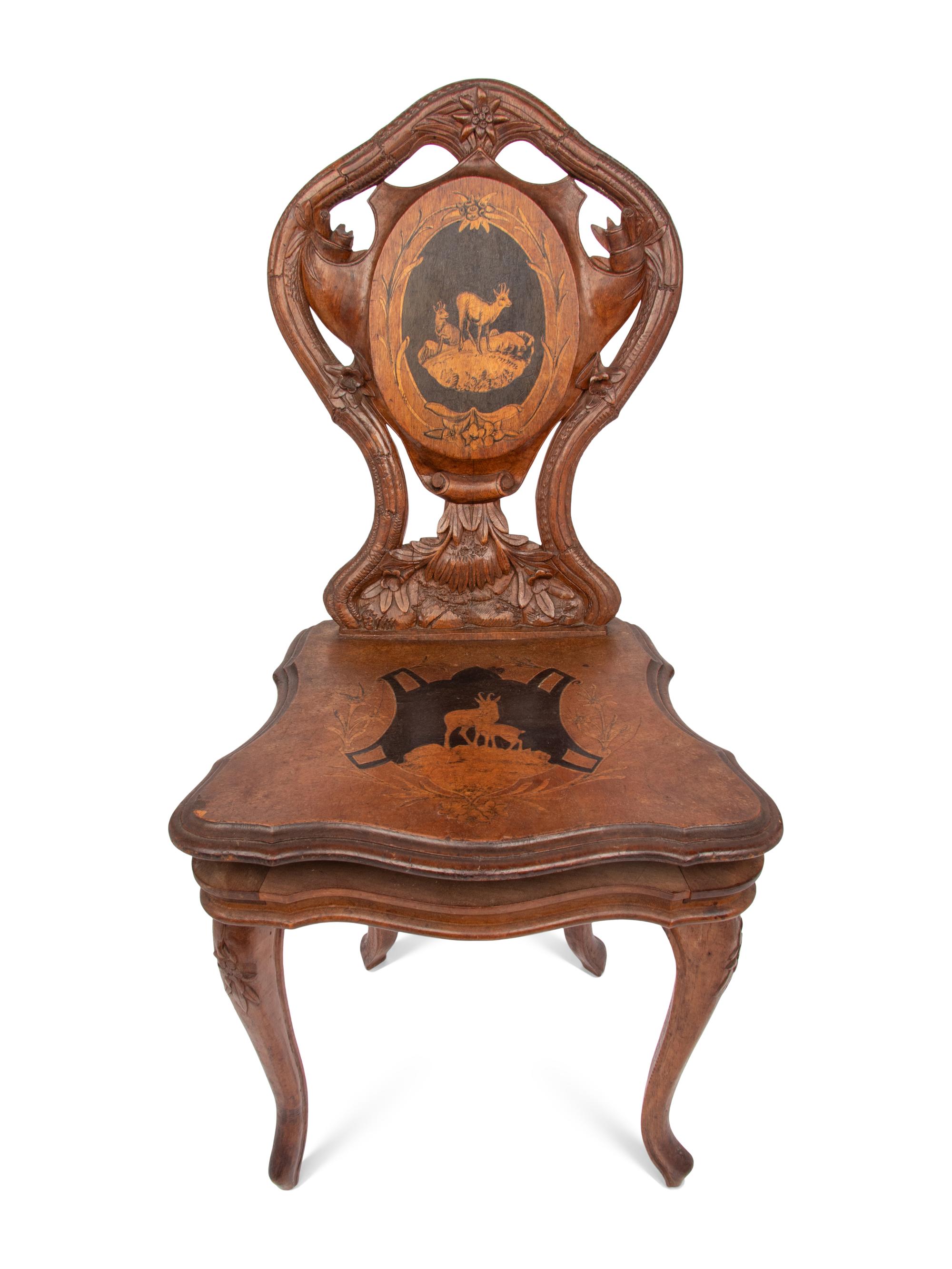 A Carved Black Forest Musical Child's Chair