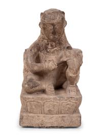 An Asian Carved Stone Seated Figure