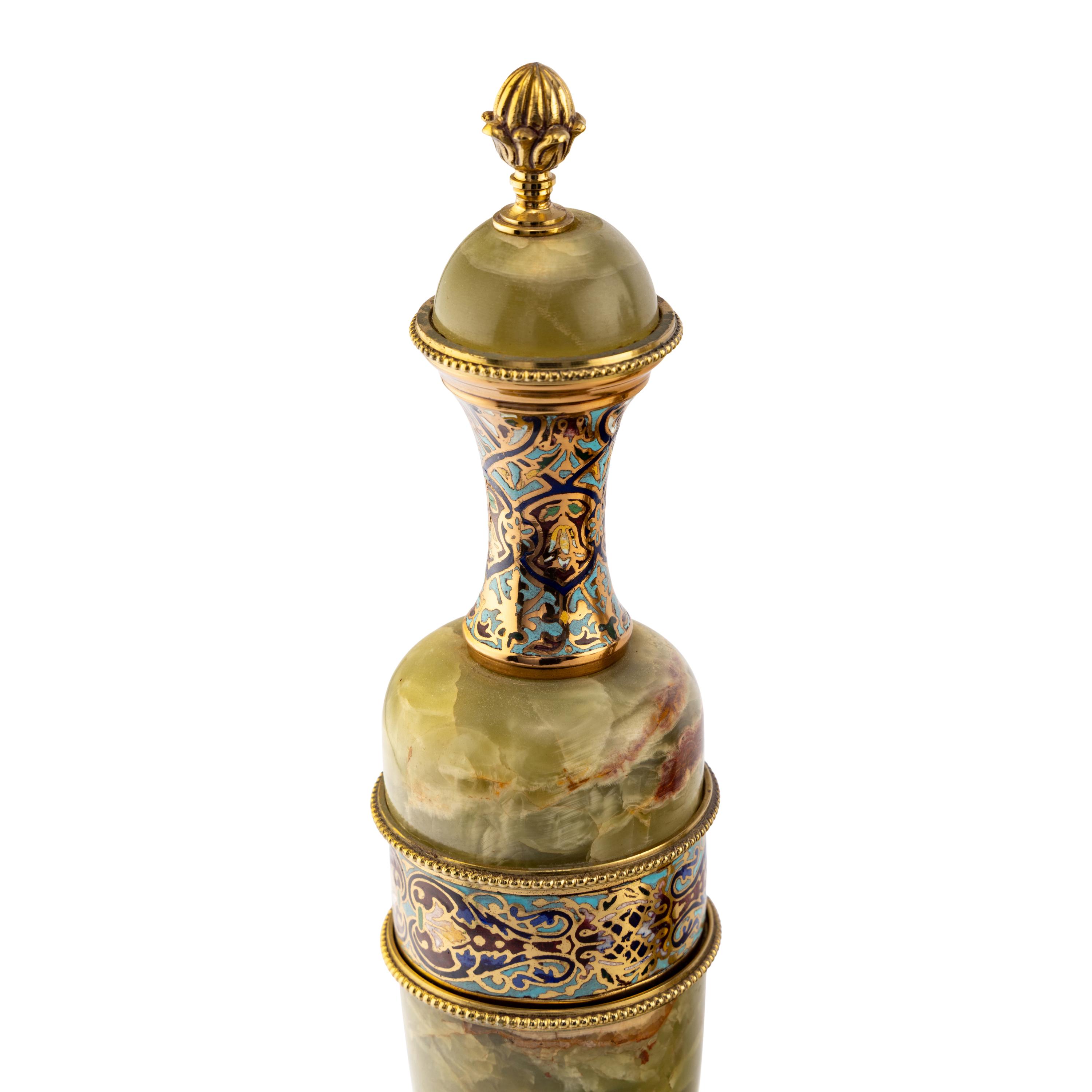 A French Green Onyx, Gilt-Metal and Champlevé Three-Piece Clock Garniture