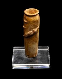 An Egyptian Bone Vase with Crocodiles in Relief