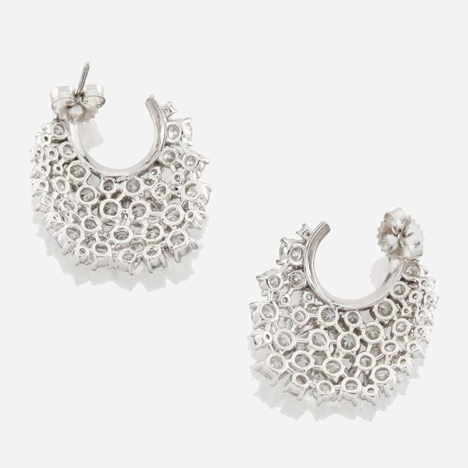 A pair of diamond and white gold earrings